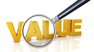 A magnifying glass propped up against the word "Value."
